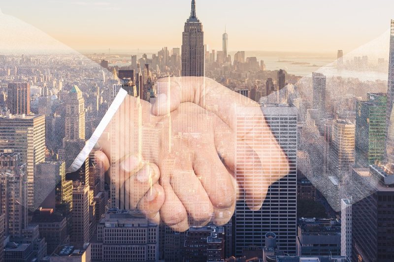 shaking hands, handshake, skyline-3096229.jpg